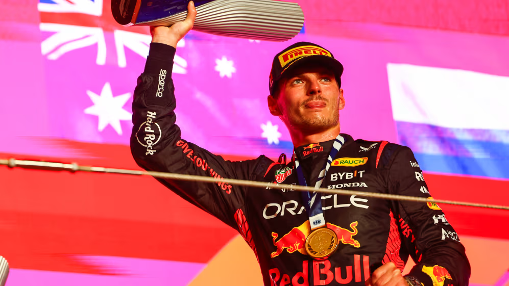 Max Verstappen won his first race as a triple Formula One world champion in a pitstop-heavy Qatar Grand Prix.