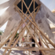 The Sharjah Architecture Triennial's second edition features a variety of structures made from reused telephone poles and raw construction materials.