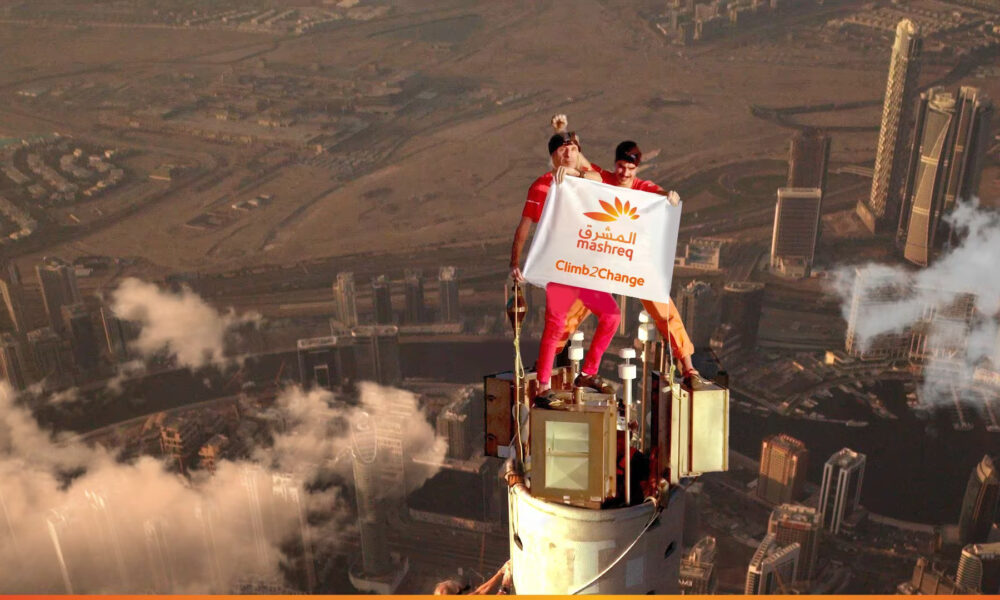 French Spiderman and associates take nine hours to reach the top of the planet's tallest building.